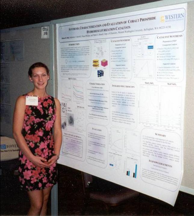Denise Bale standing in front of poster at ACS