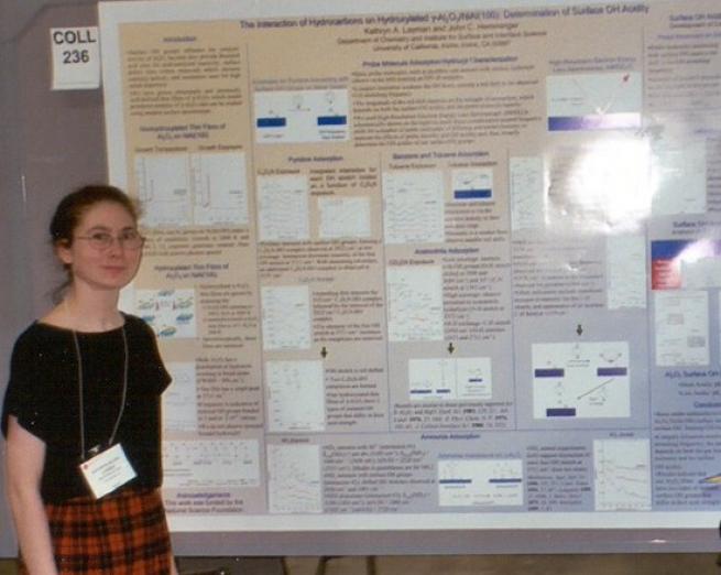Katy Layman standing in front of poster at ACS
