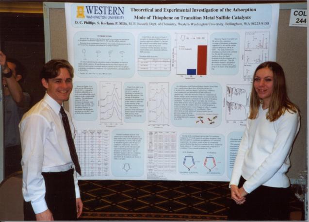 Scott Korlann and Diana Phillips standing in front of poster at ACS