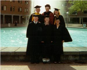 six graduates pose in front of the Western fountain