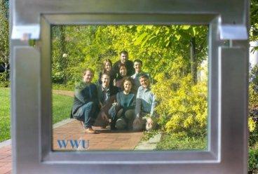 students stand behind solar window at wwu