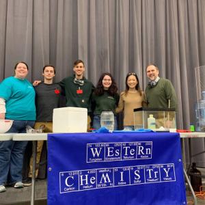 image of chem club behind table at event