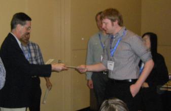 John Hayes receiving his Colloid & Surface Chemistry Division Poster Award.